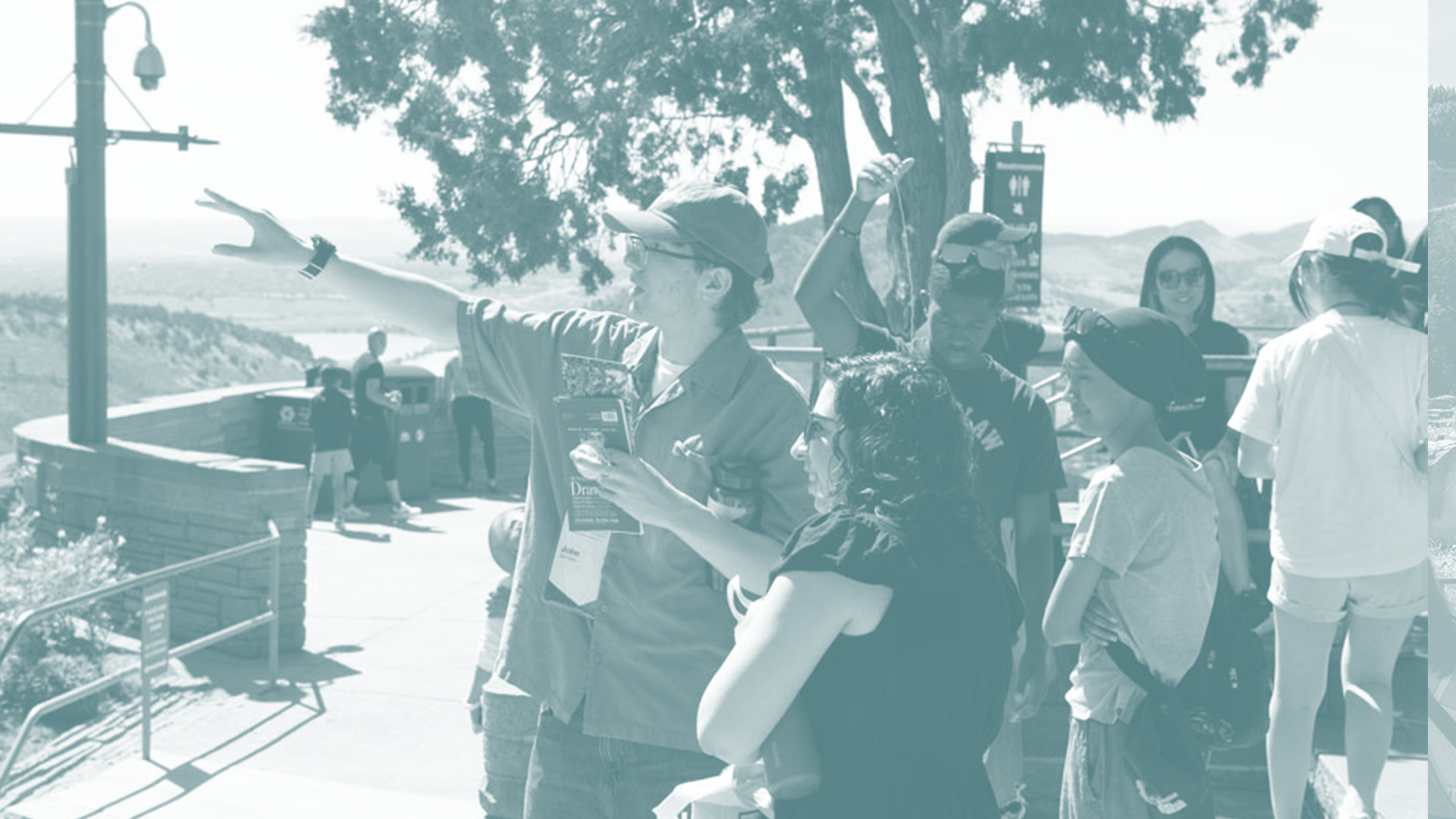 Students at Red Rocks pointing out toward the stage.