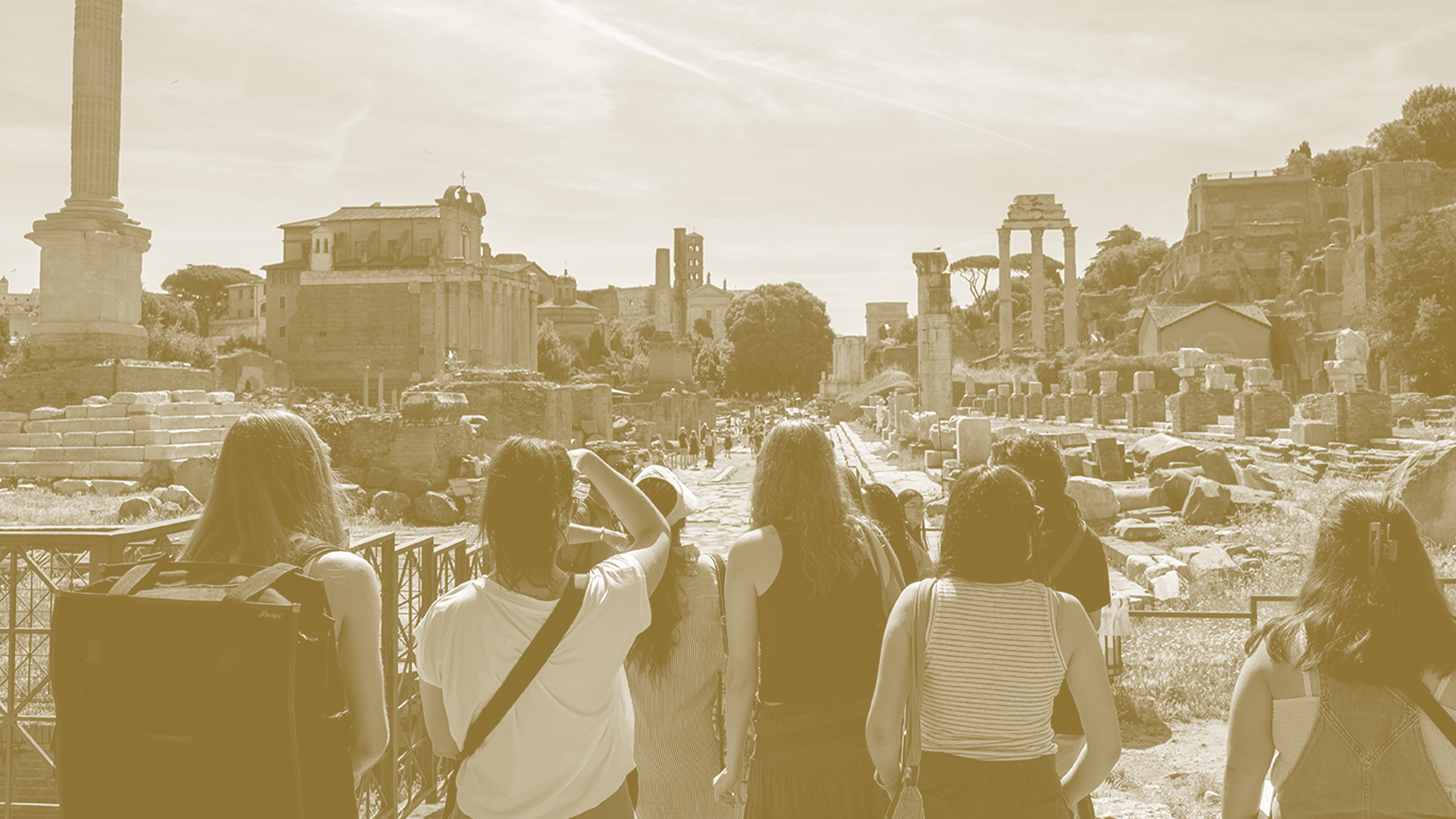 Students overlooking ancient ruins in Rome.
