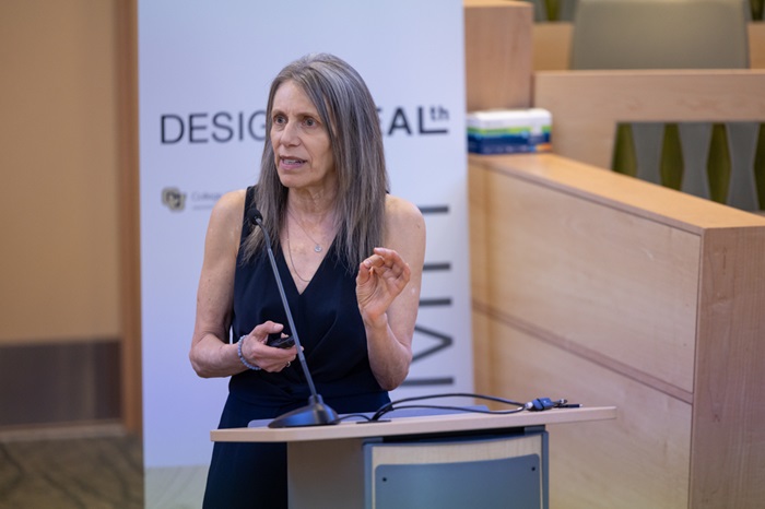 NanEllinspeakingatapodium