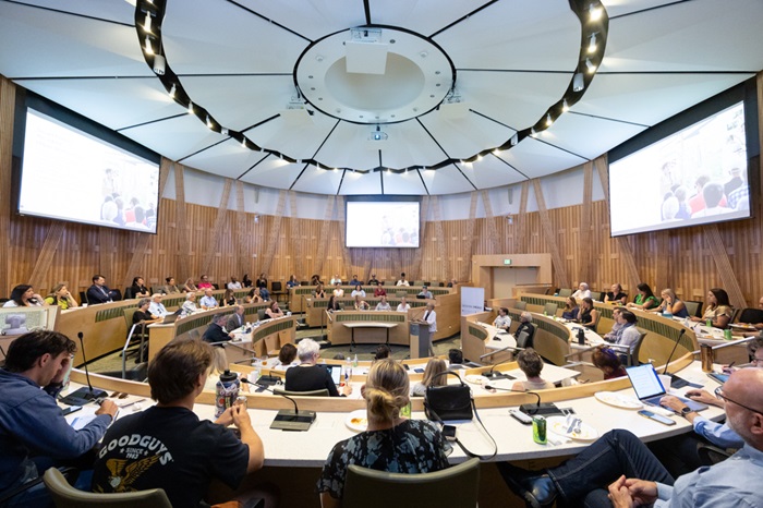 Peoplegatheredinacircularauditorium