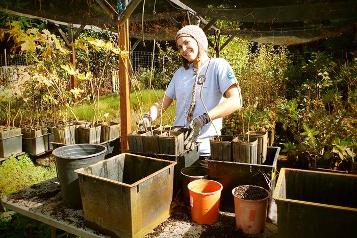 Katie Finnigan working in a garden.