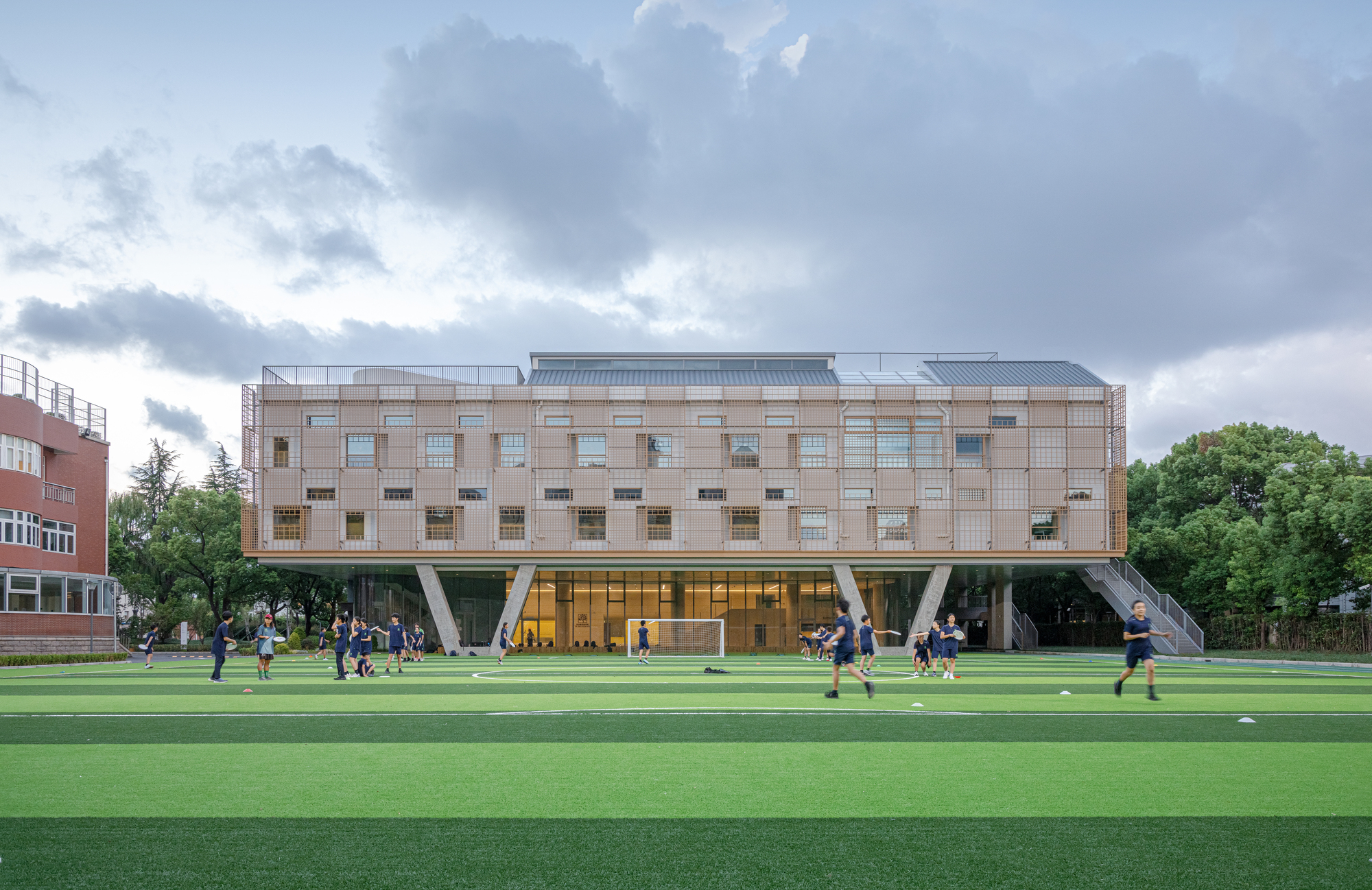 Exterior of the Anna Pao Shomen Centre and a soccer field.