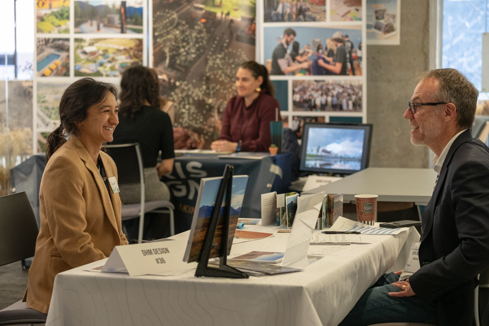 Rachel Thody sitting at a table meeting with a potential employer at the CAP Career Fair.