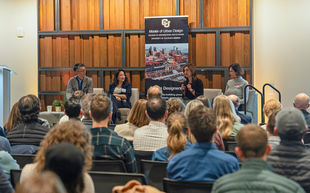 Four presenters on stage at the Urban Design Spotlight event in the Jake Jabs Center.