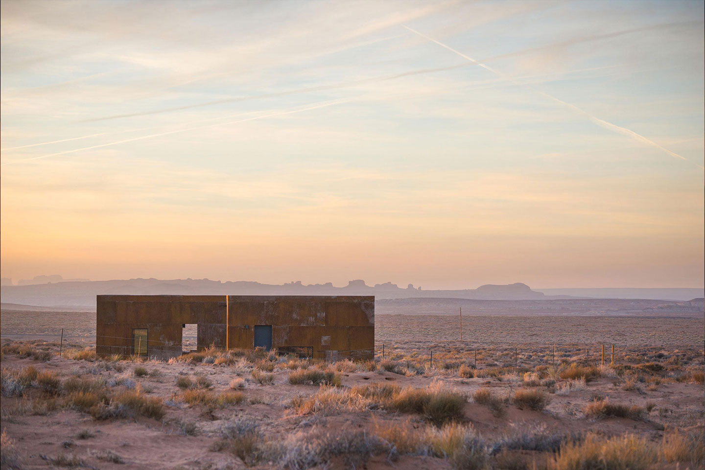 The Redsand Cabin projects exterior at sunset. 