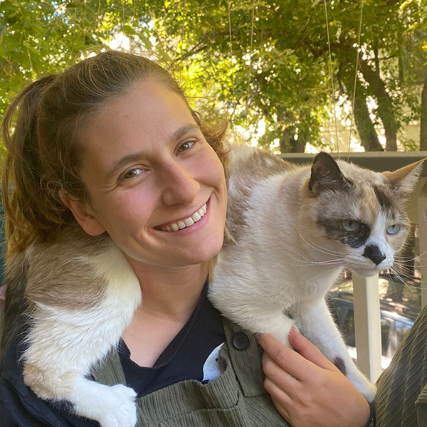 Lexi Bernstein with a cat on her shoulder.