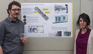 Two students pose with their AIAS public restroom design competition entry