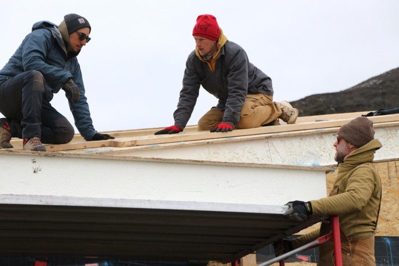 Antarctica crew installs the roof on the dwelling unit in Antarctica