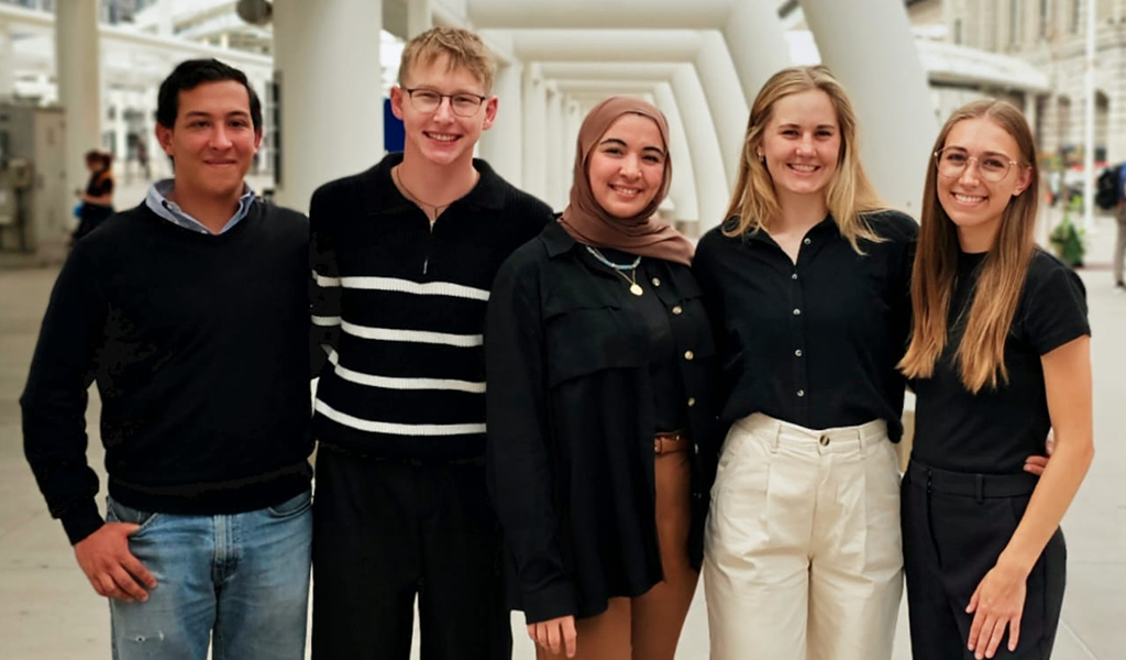 The 2025 CU Denver AIAS student chapter officers standing together in front of Denver's Union Station.