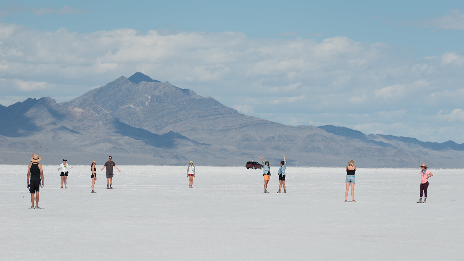 Students wave to the camera at the Bonneville Salt Flats