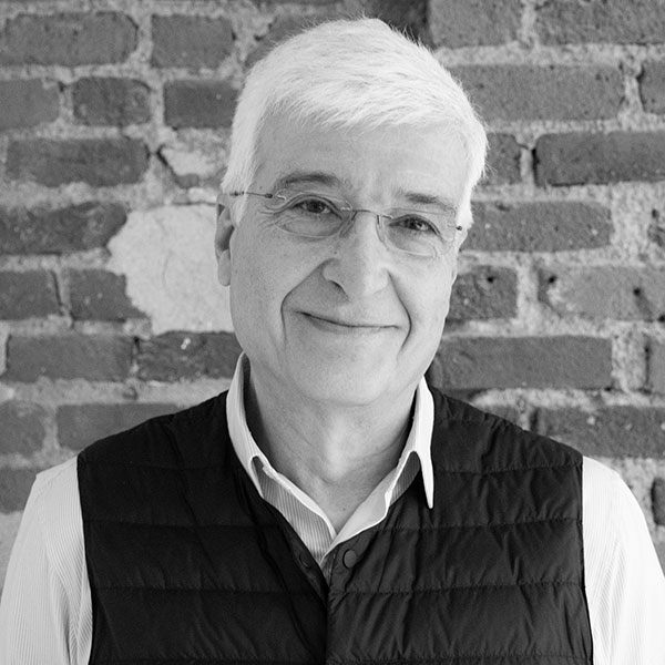 Amir Ameri's headshot in black and white.