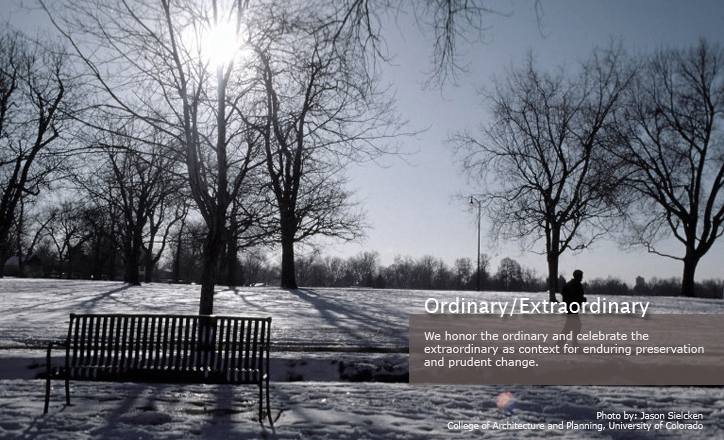 winter scene of park bench with snow on the ground