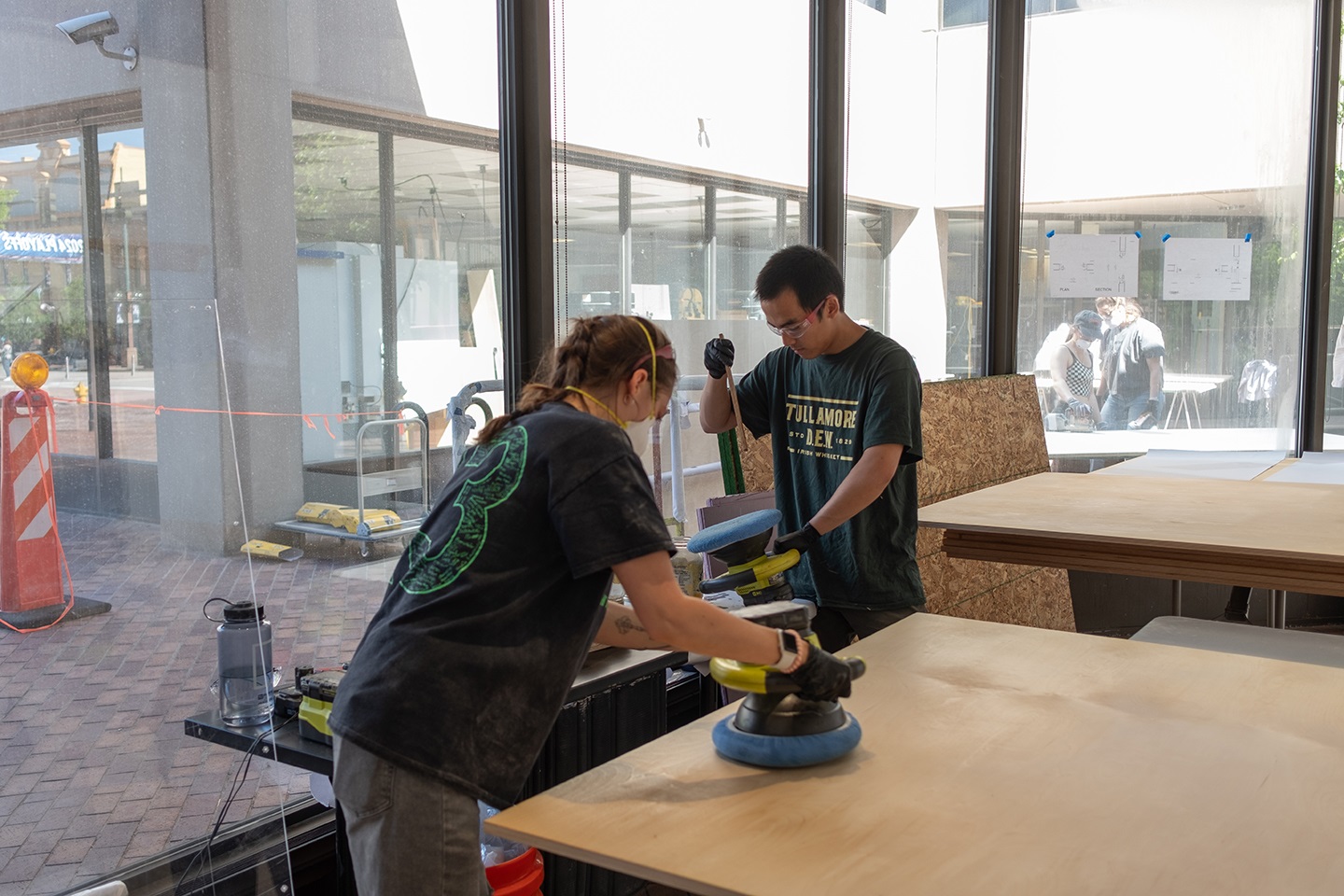 Two students working in the fabrication lab at CU Denver.