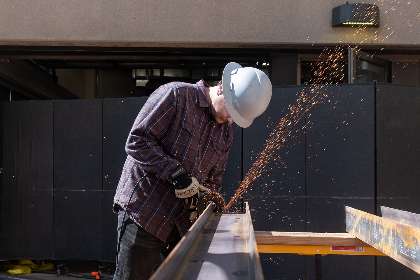 One student welding material from a kiosk.
