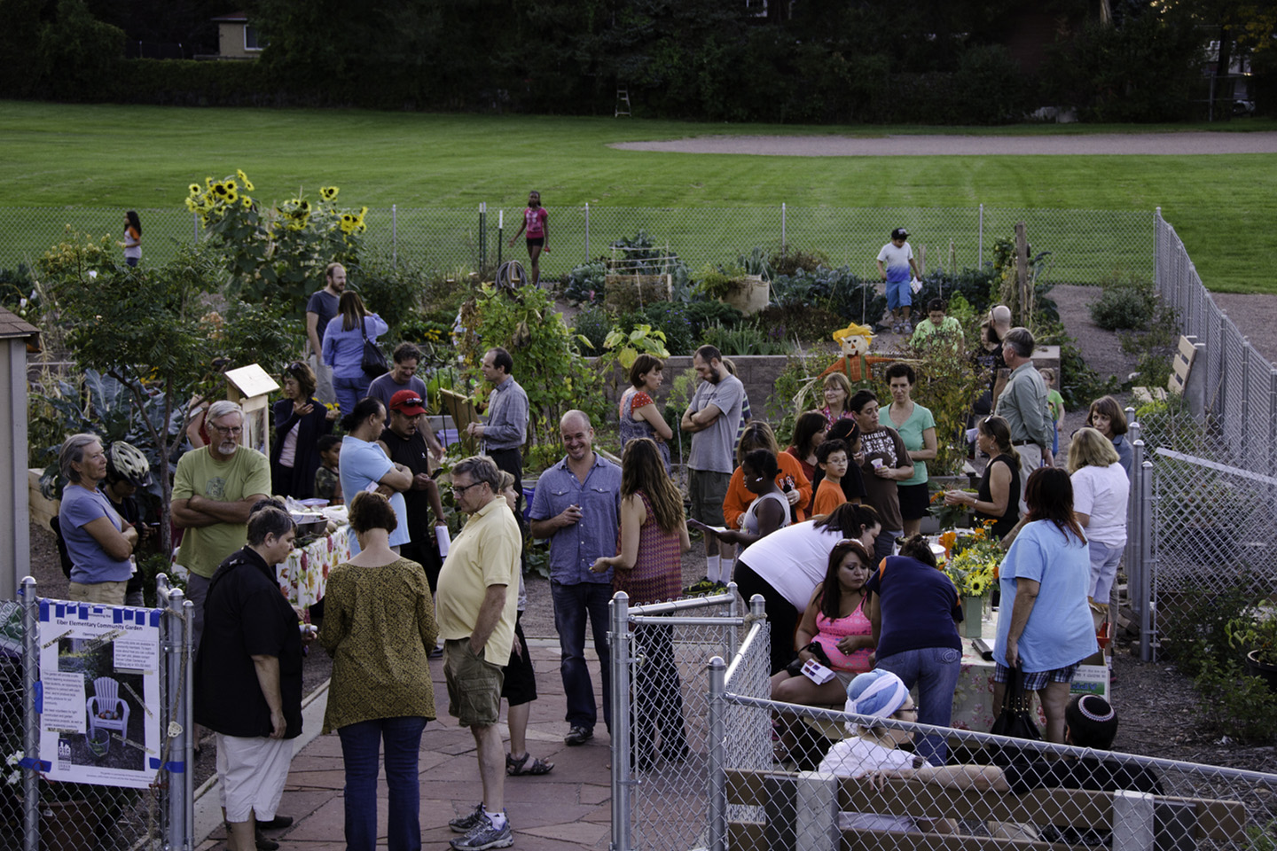 People talking during a reception in the Eiber Garden.